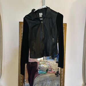 Black leather jacket with sweater sleeves